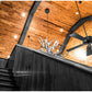 A rustic hunting cabin in Texas with Texas Post Oak wood paneling on the ceiling. 