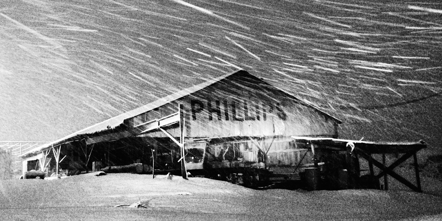 Cecil Phillips lumber in De Kalb, Tx during a Texas snow storm. The mill is recognized as the oldest family owned sawmill in the state of Texas. 